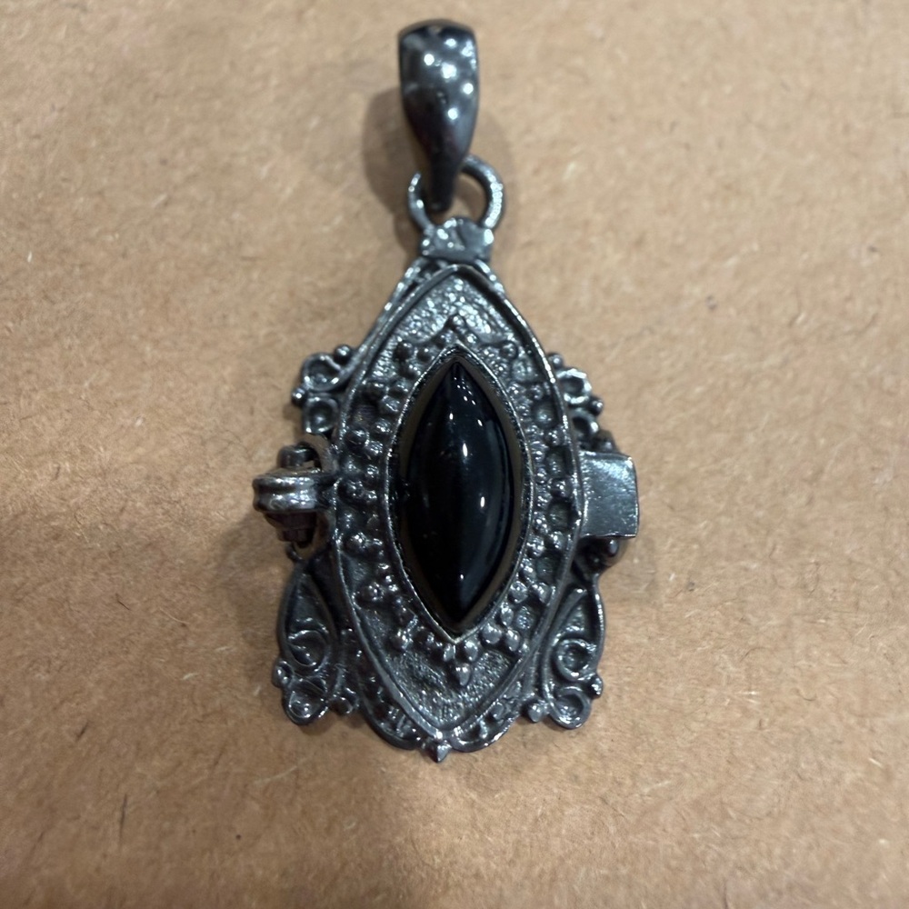 Elegant Black and Silver Poison Pendant